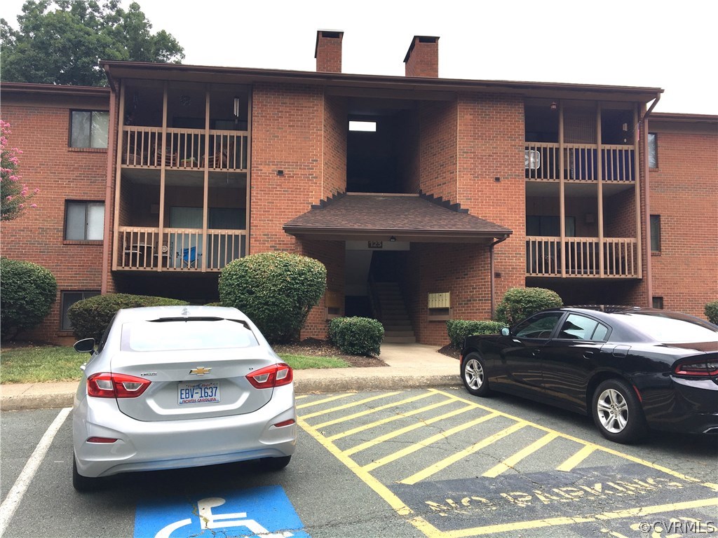 123 Turtle Creek Road, Unit 5 Charlottesville, VA 22901 - Photo 17 of 18 a car parked in front of a house