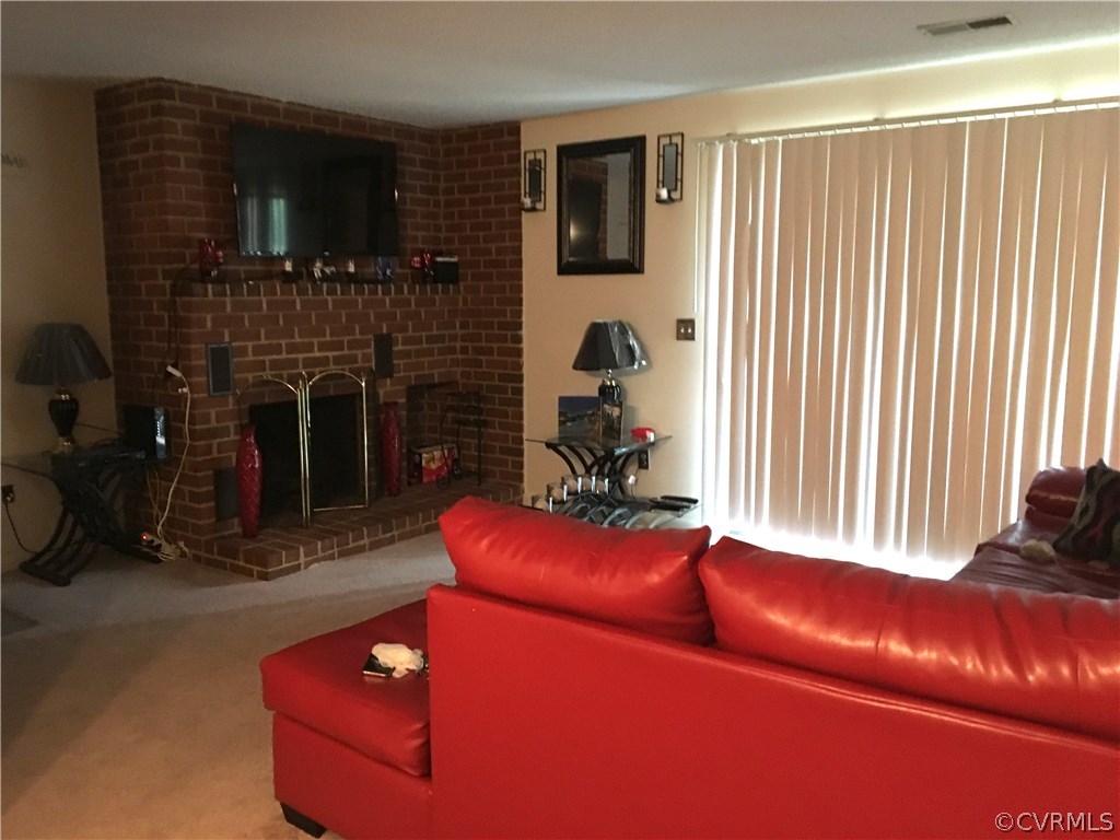 123 Turtle Creek Road, Unit 5 Charlottesville, VA 22901 - Photo 3 of 18 a living room with furniture and a fireplace
