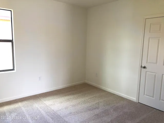 a bathroom with a granite countertop shower and a sink