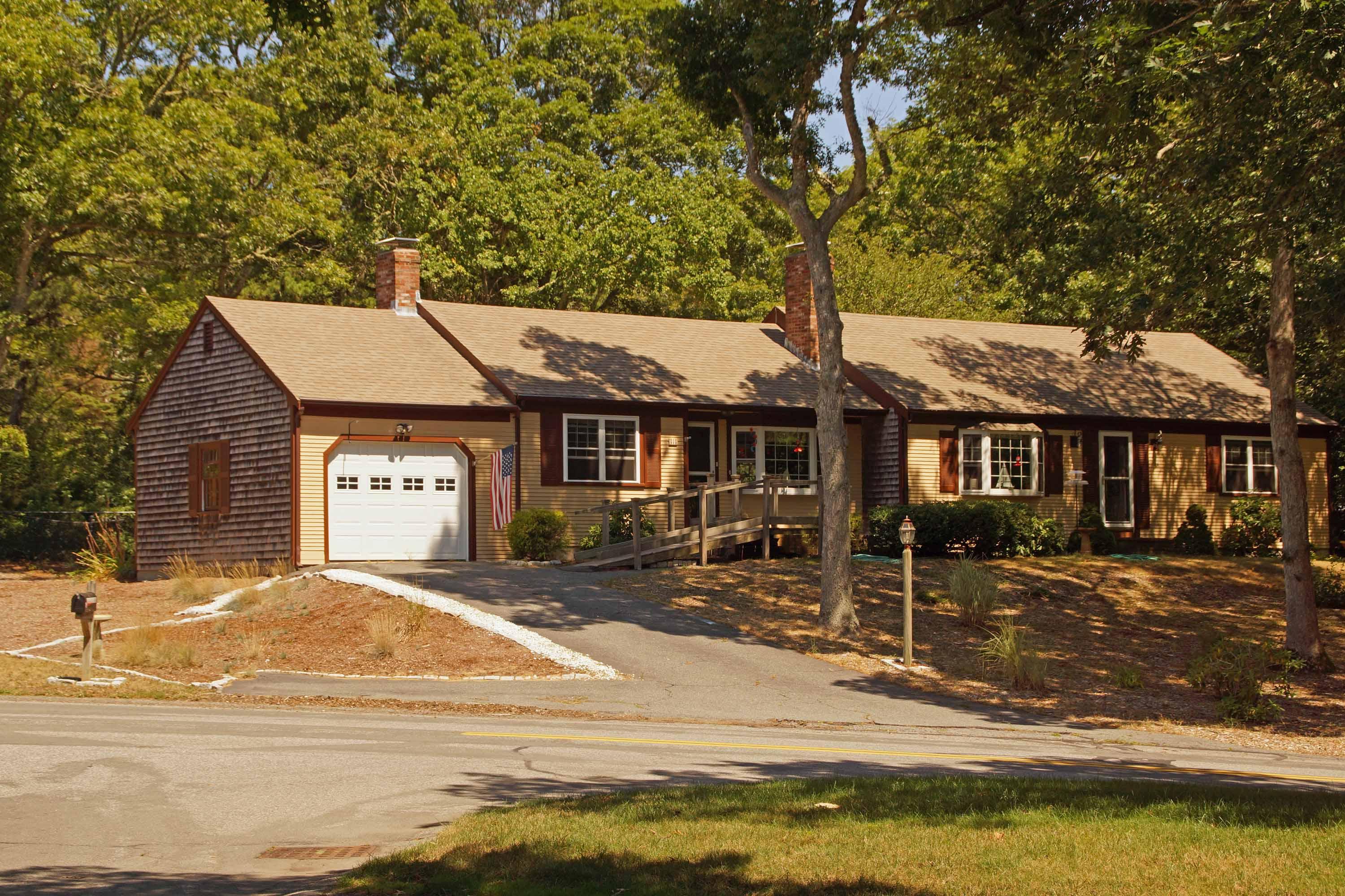 a front view of a house with a yard