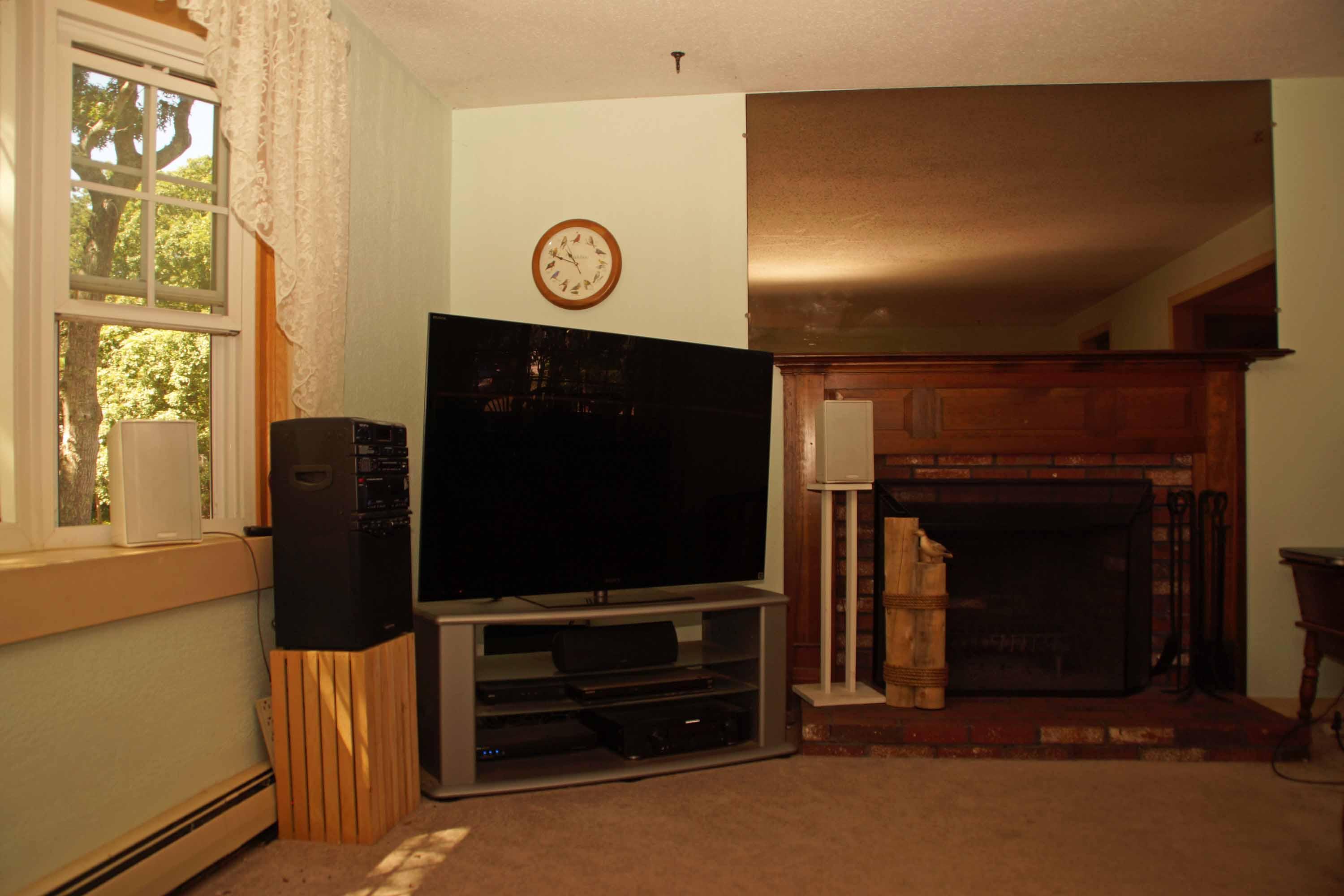 111 Azalea Drive Harwich, MA 02645 - Photo 11 of 26 a living room with furniture and a flat screen tv