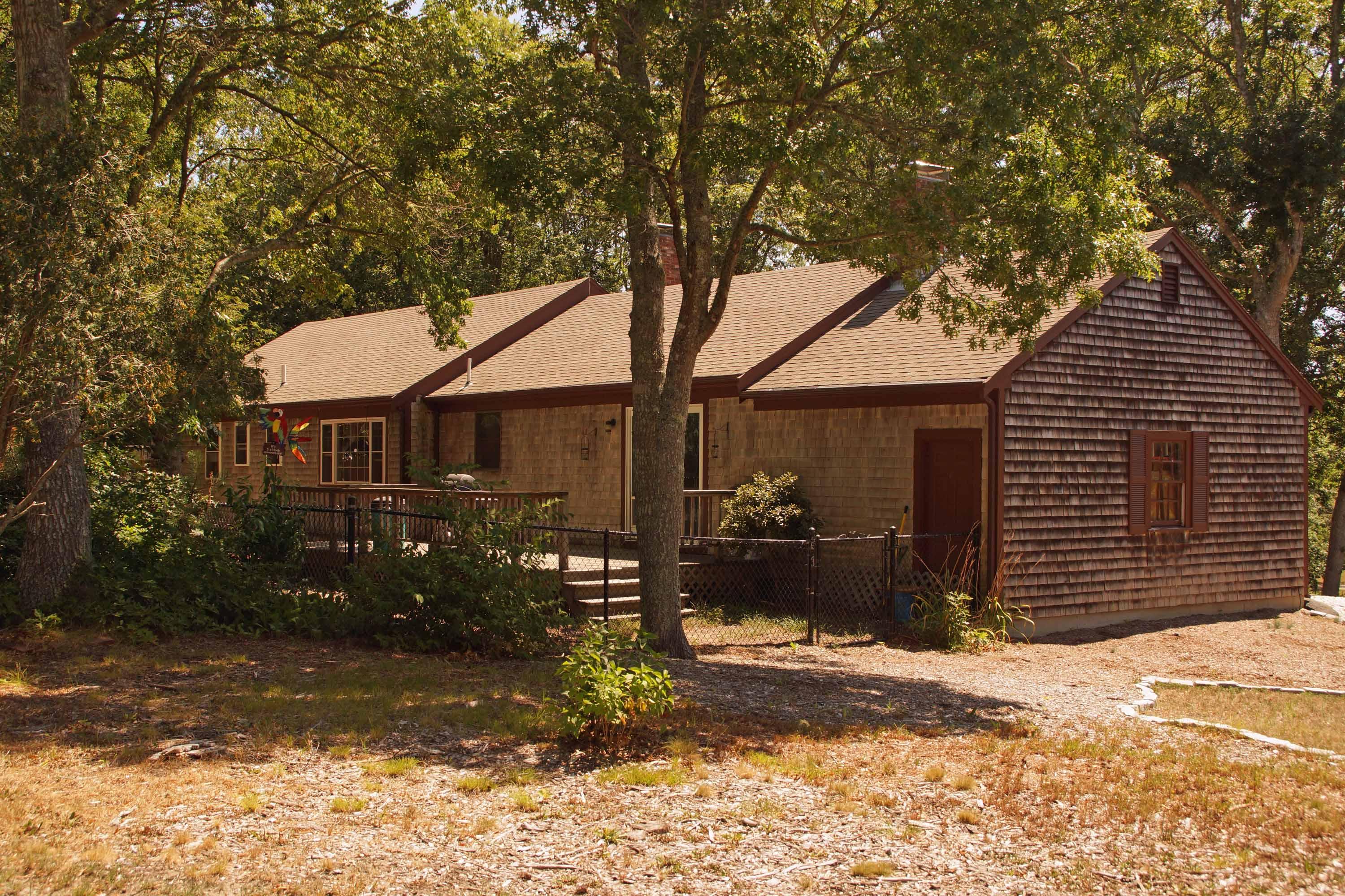 111 Azalea Drive Harwich, MA 02645 - Photo 16 of 26 a front view of a house with a yard