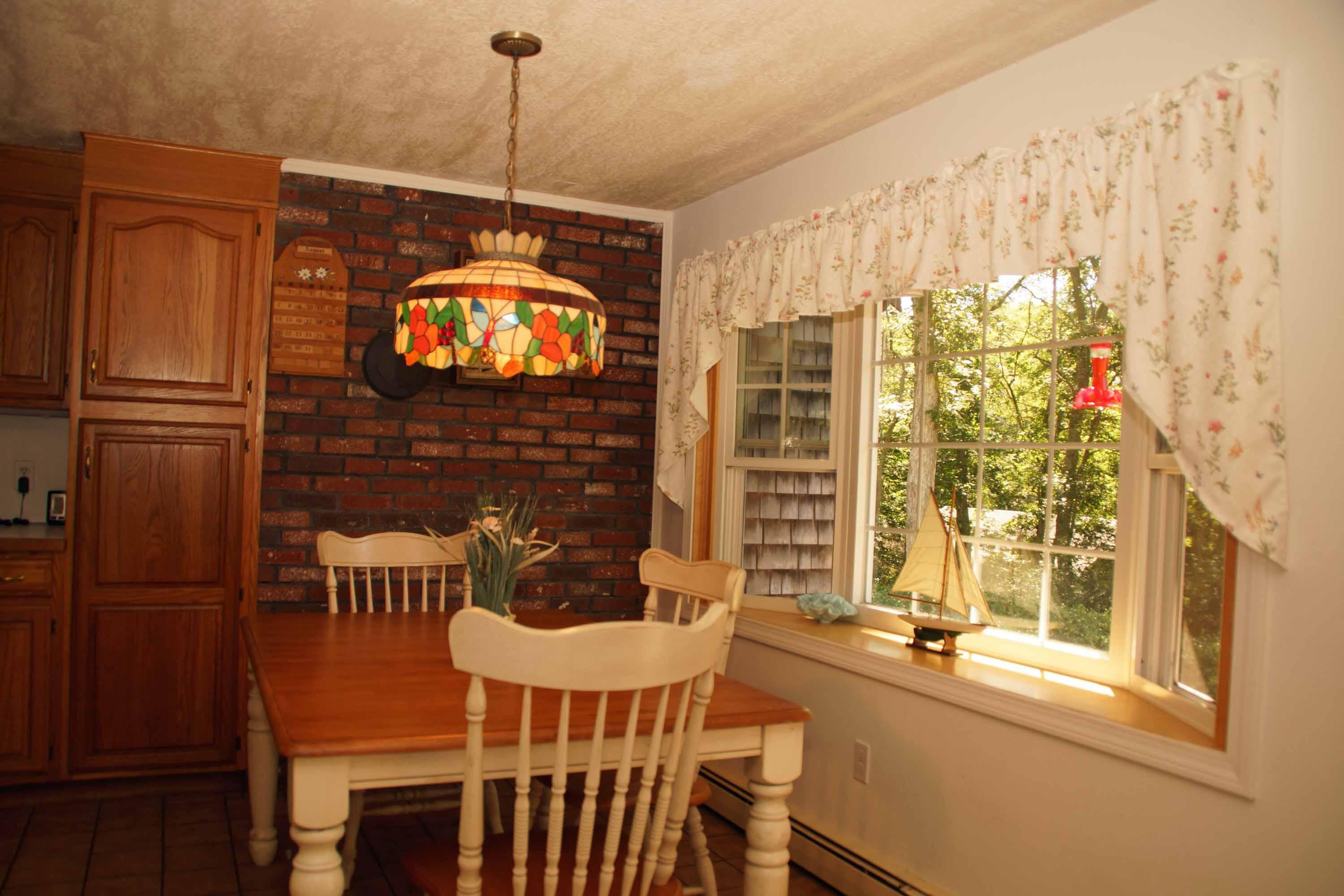 111 Azalea Drive Harwich, MA 02645 - Photo 3 of 26 a dining room with furniture and window