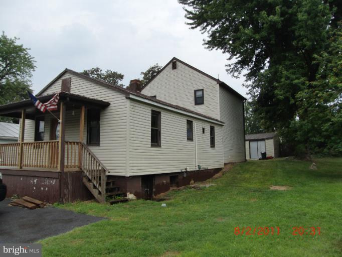402-11 East 11th Avenue Ranson, WV 25438 - Photo 1 of 19 a view of front of house with a yard