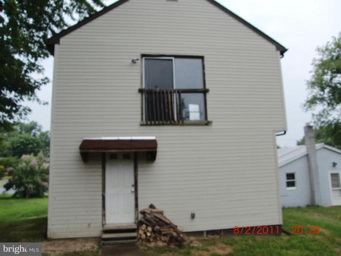 402-11 East 11th Avenue Ranson, WV 25438 - Photo 15 of 19 a view of a house with a yard and garage