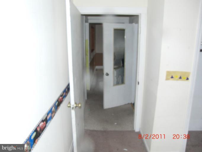 402-11 East 11th Avenue Ranson, WV 25438 - Photo 3 of 19 a view of a hallway with wooden floor