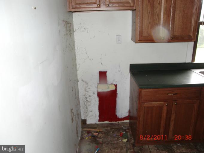 402-11 East 11th Avenue Ranson, WV 25438 - Photo 5 of 19 a bathroom with a sink and a mirror