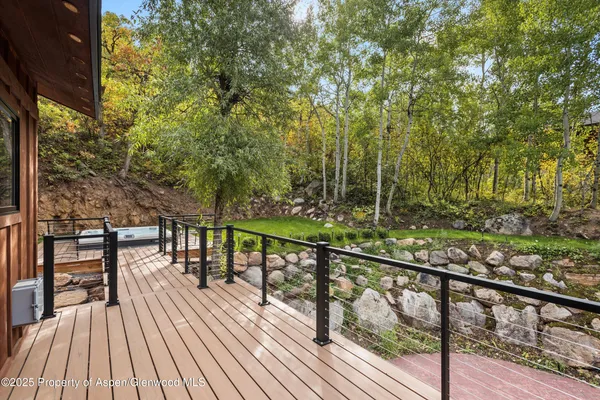 a view of a balcony with wooden floor