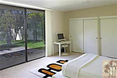 70642 Boothill Road Rancho Mirage, CA 92270 - Photo 15 of 15 a bedroom with a bed and large window