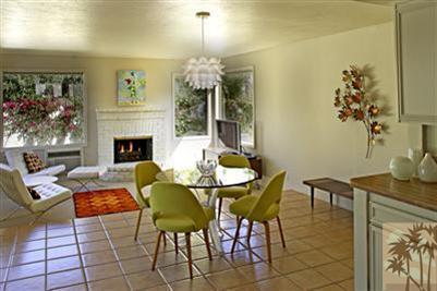 70642 Boothill Road Rancho Mirage, CA 92270 - Photo 6 of 15 a living room with furniture dining table and a fireplace