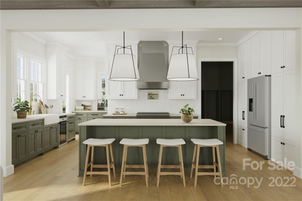 609 Lochridge Road Charlotte, NC 28209 - Photo 8 of 14 a kitchen with a dining table chairs cabinets and stainless steel appliances
