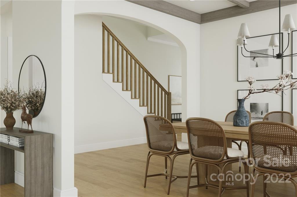 609 Lochridge Road Charlotte, NC 28209 - Photo 9 of 14 a dining room with furniture and a potted plant