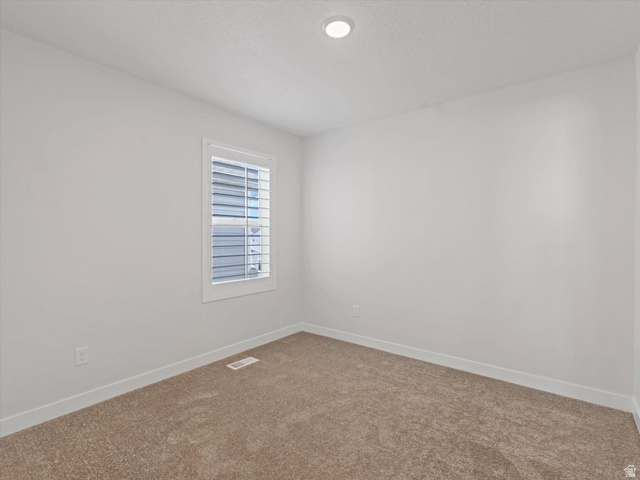 11759 South Watercourse Road South Jordan, UT 84009 - Photo 14 of 33 Neutral tone wall paint, recessed ceiling lighting, textured carpeting, white window trim, and horizontal window blinds