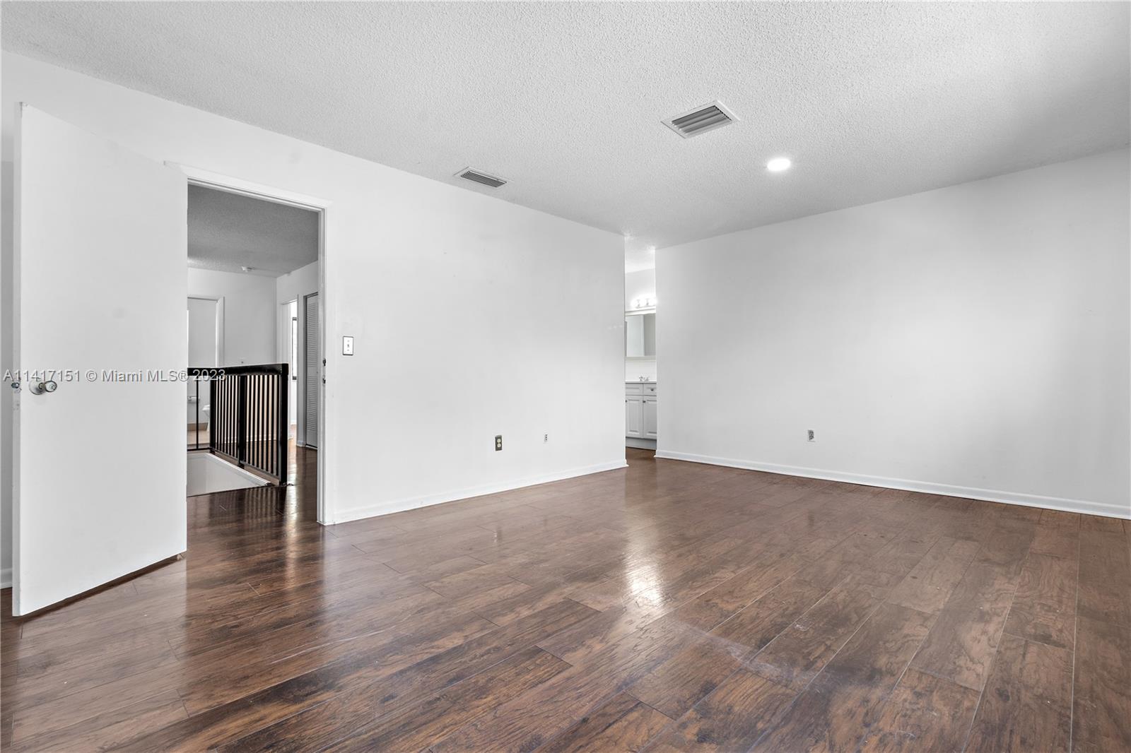 9435 Southwest 151st Avenue Miami, FL 33196 - Photo 11 of 35 a view of a room with wooden floor