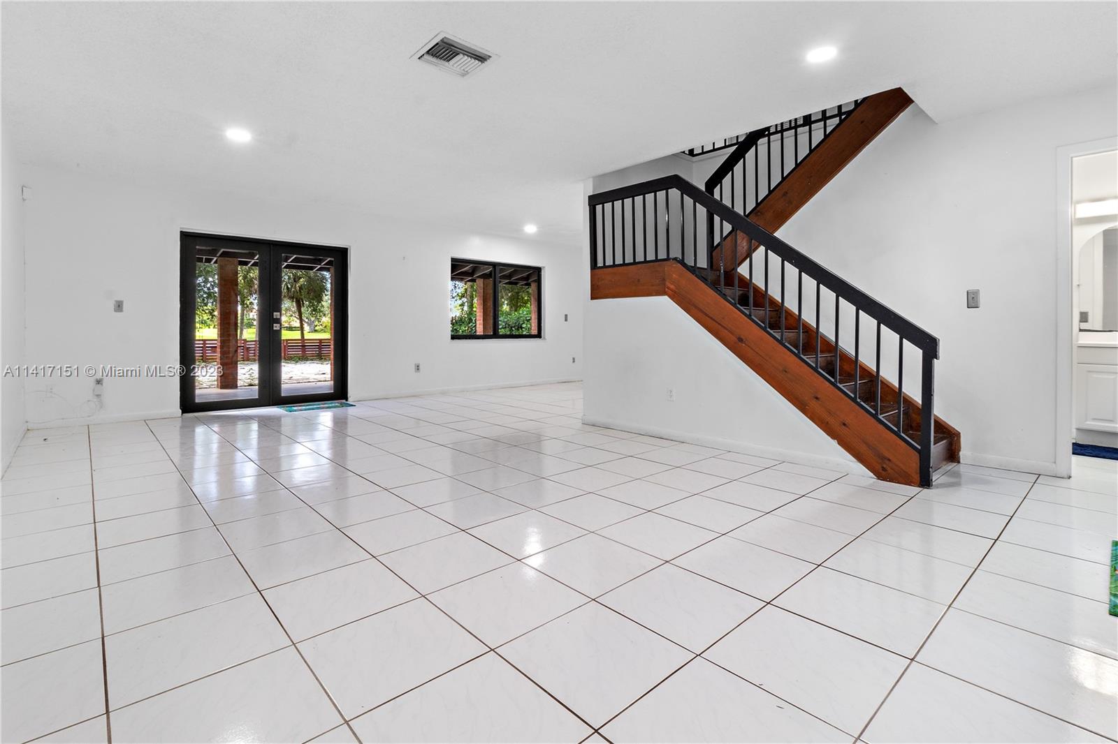 9435 Southwest 151st Avenue Miami, FL 33196 - Photo 2 of 35 a view of an entryway with wooden floor