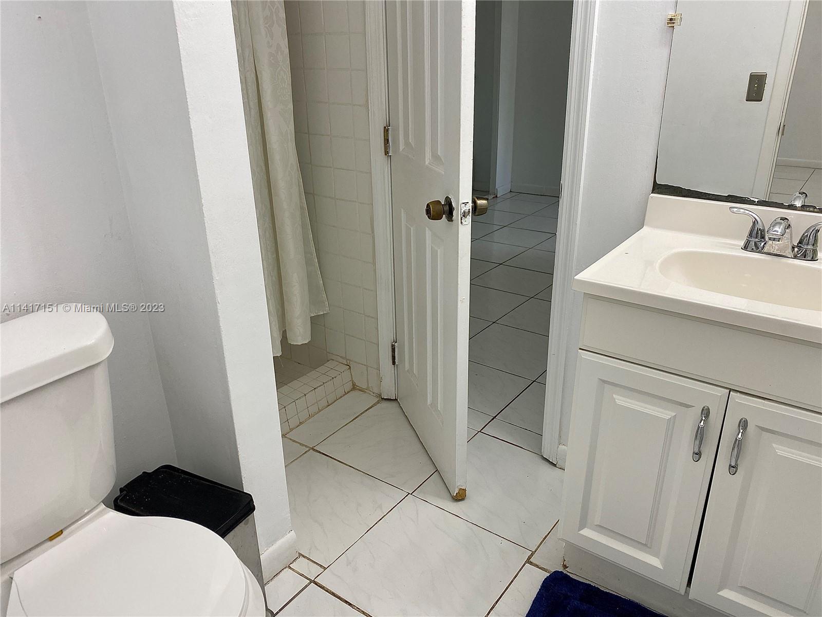 9435 Southwest 151st Avenue Miami, FL 33196 - Photo 22 of 35 a bathroom with a sink and a mirror