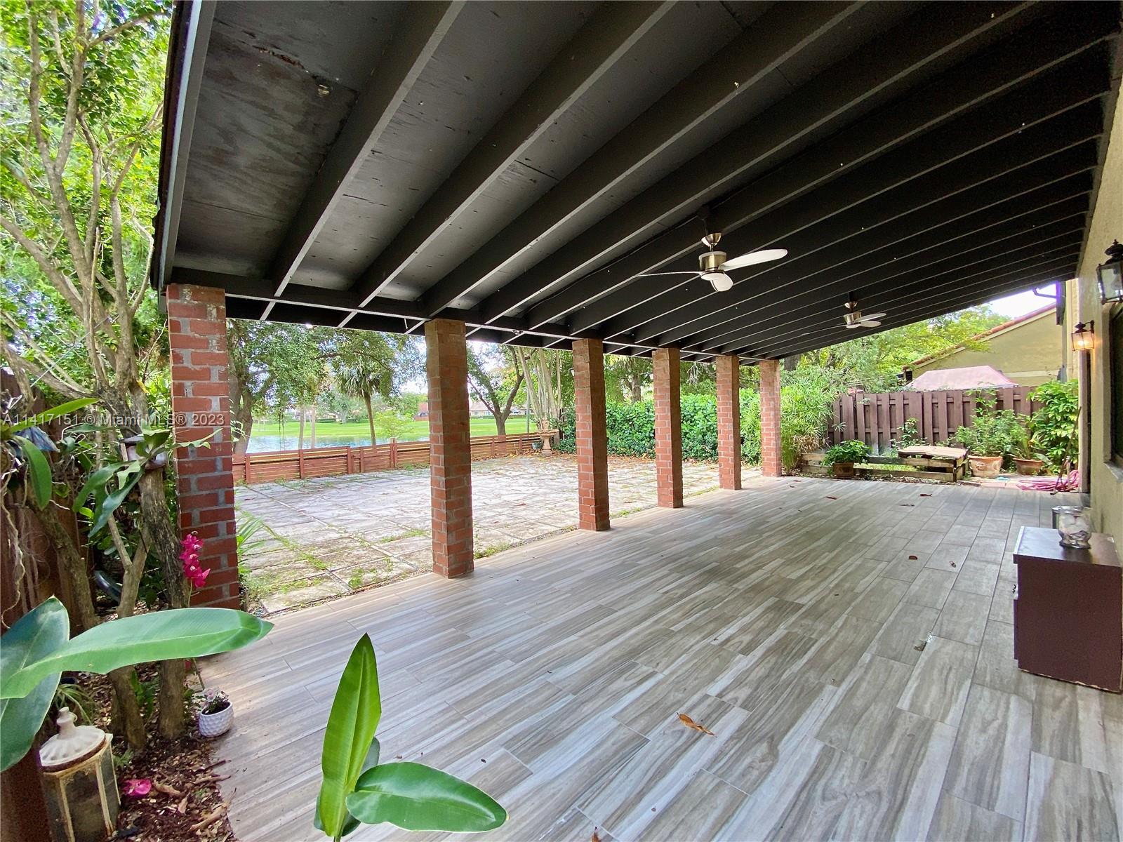 9435 Southwest 151st Avenue Miami, FL 33196 - Photo 23 of 35 a porch with seating space
