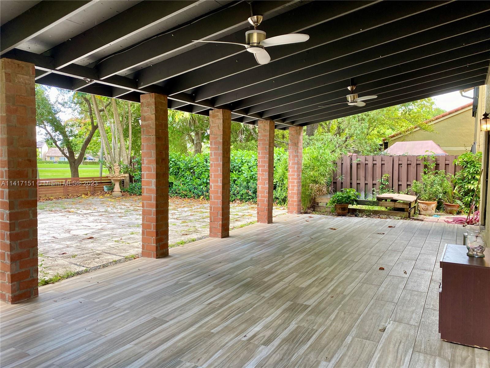 9435 Southwest 151st Avenue Miami, FL 33196 - Photo 24 of 35 a view of porch with wooden floor