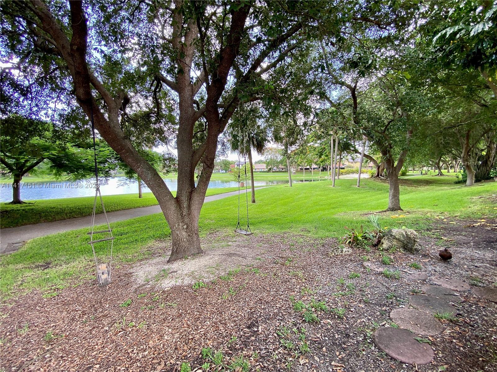 9435 Southwest 151st Avenue Miami, FL 33196 - Photo 25 of 35 a view of a house with a backyard