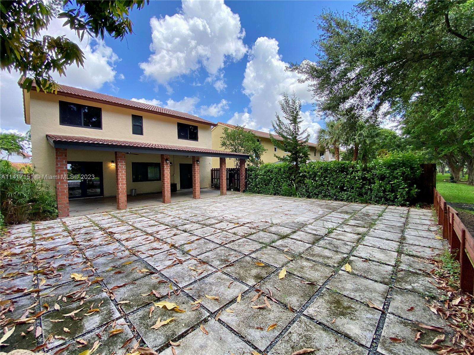 9435 Southwest 151st Avenue Miami, FL 33196 - Photo 27 of 35 a view of a house with a yard