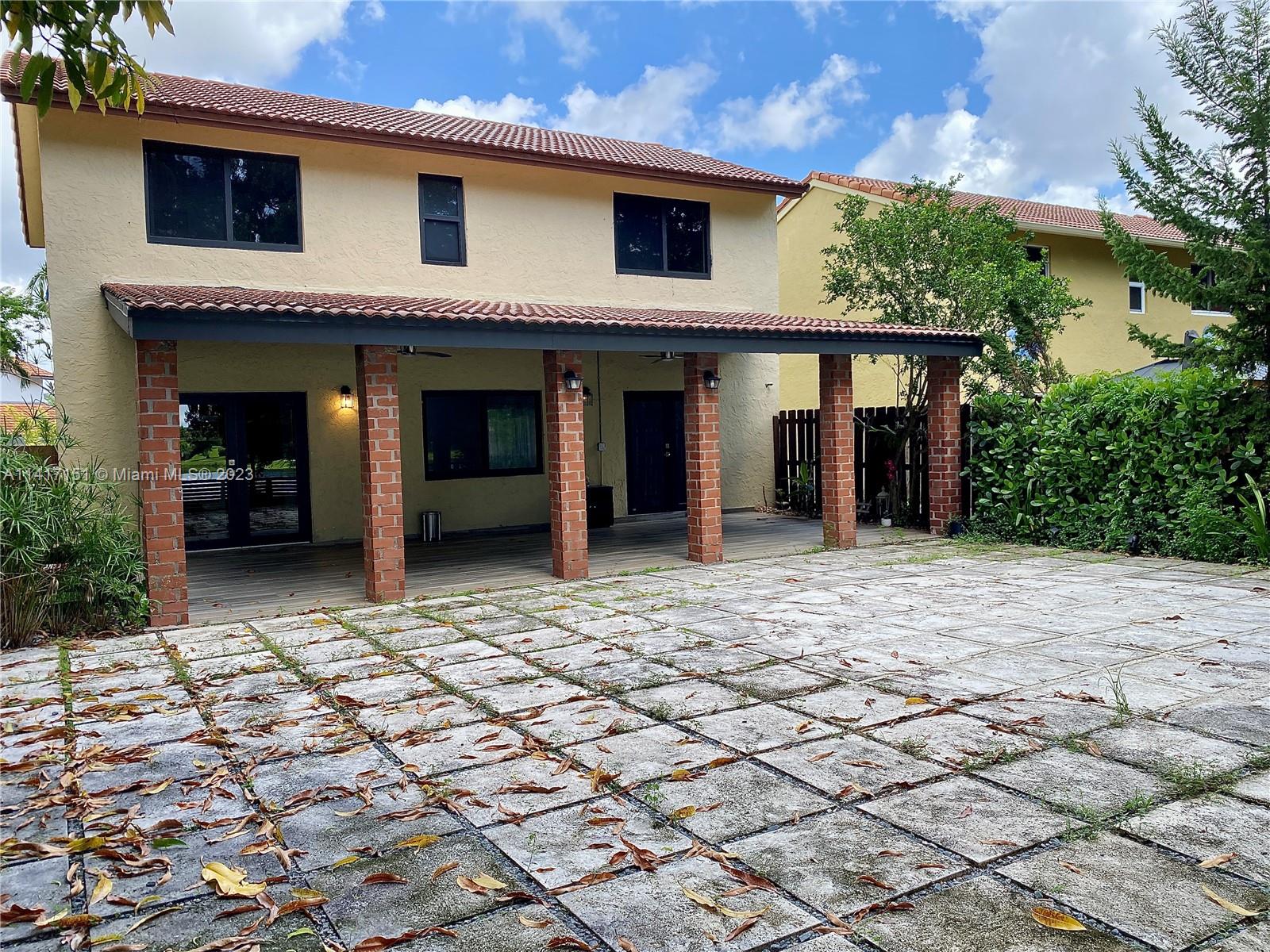 9435 Southwest 151st Avenue Miami, FL 33196 - Photo 28 of 35 a view of a house with a porch
