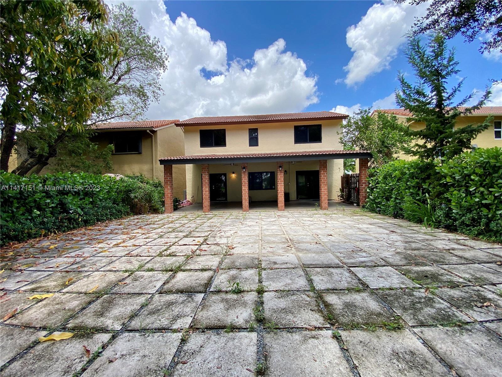 9435 Southwest 151st Avenue Miami, FL 33196 - Photo 29 of 35 a view of house with yard and entertaining space