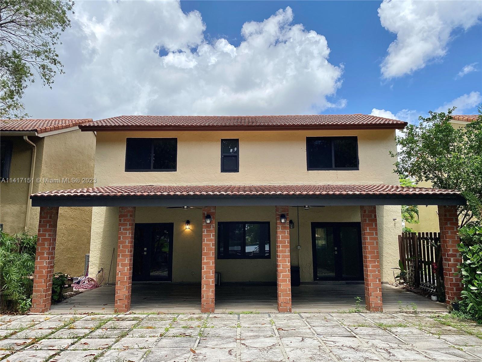 9435 Southwest 151st Avenue Miami, FL 33196 - Photo 30 of 35 a front view of a house