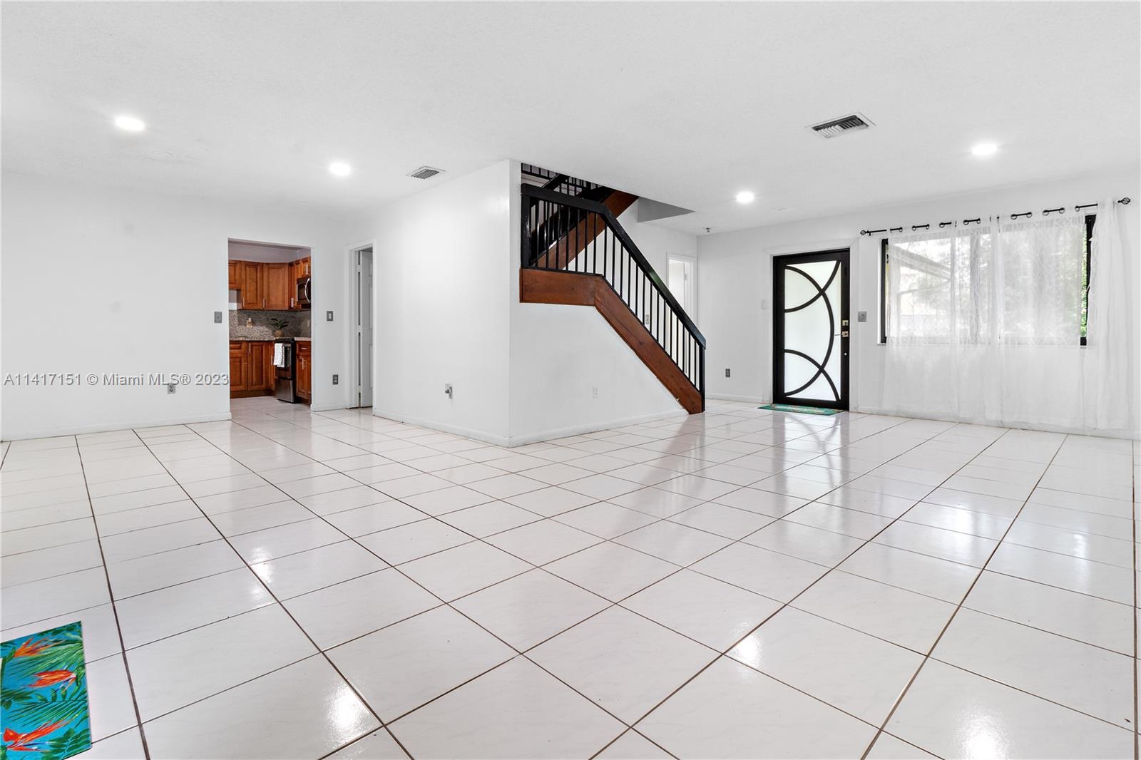 9435 Southwest 151st Avenue Miami, FL 33196 - Photo 3 of 35 a view of an entryway with wooden floor