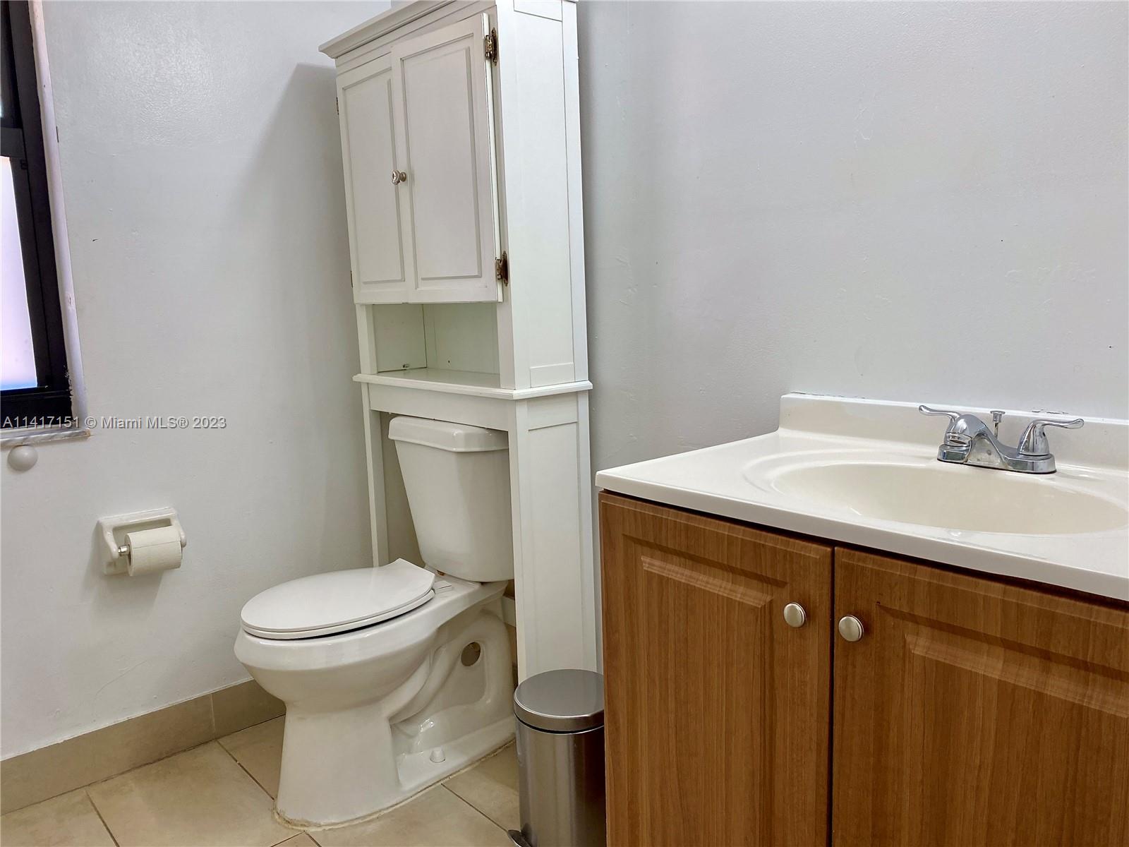 9435 Southwest 151st Avenue Miami, FL 33196 - Photo 32 of 35 a bathroom with a sink toilet and vanity