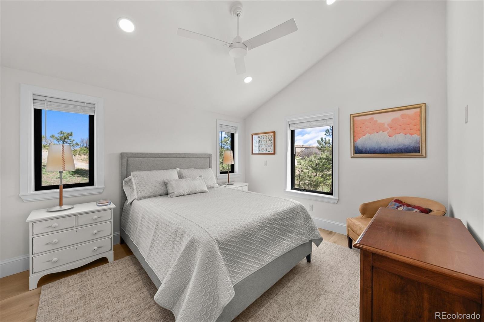 3303 West Wolfensberger Road Sedalia, CO 80135 - Photo 24 of 36 a bedroom with a bed and a desk