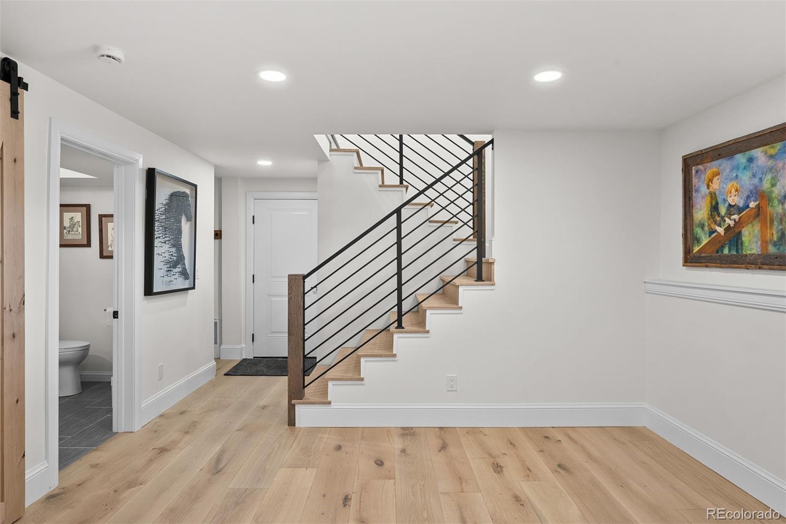 3303 West Wolfensberger Road Sedalia, CO 80135 - Photo 29 of 36 a view of entryway with wooden floor