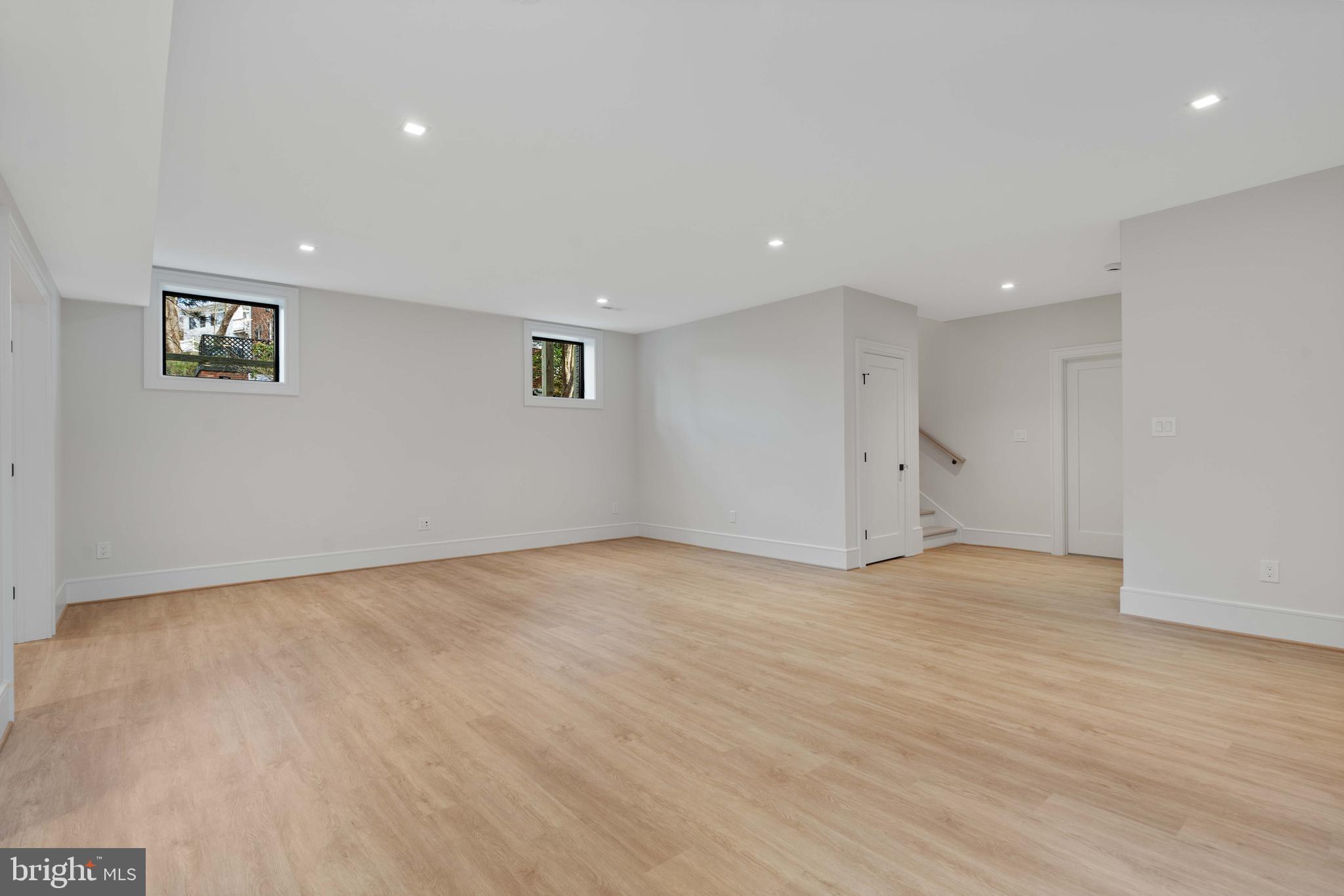 4827 33rd Road North Arlington, VA 22207 - Photo 48 of 59 LVP flooring and recessed lighting in rec room