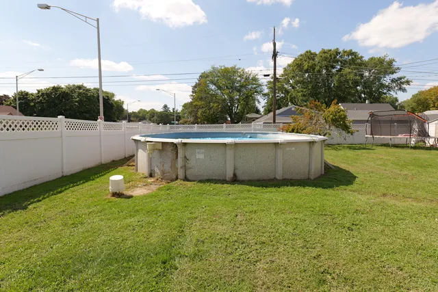 a view of a backyard with sitting area
