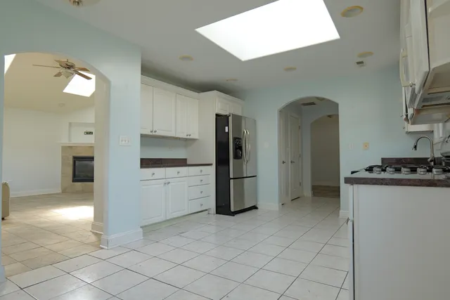 a kitchen with a refrigerator sink and stove
