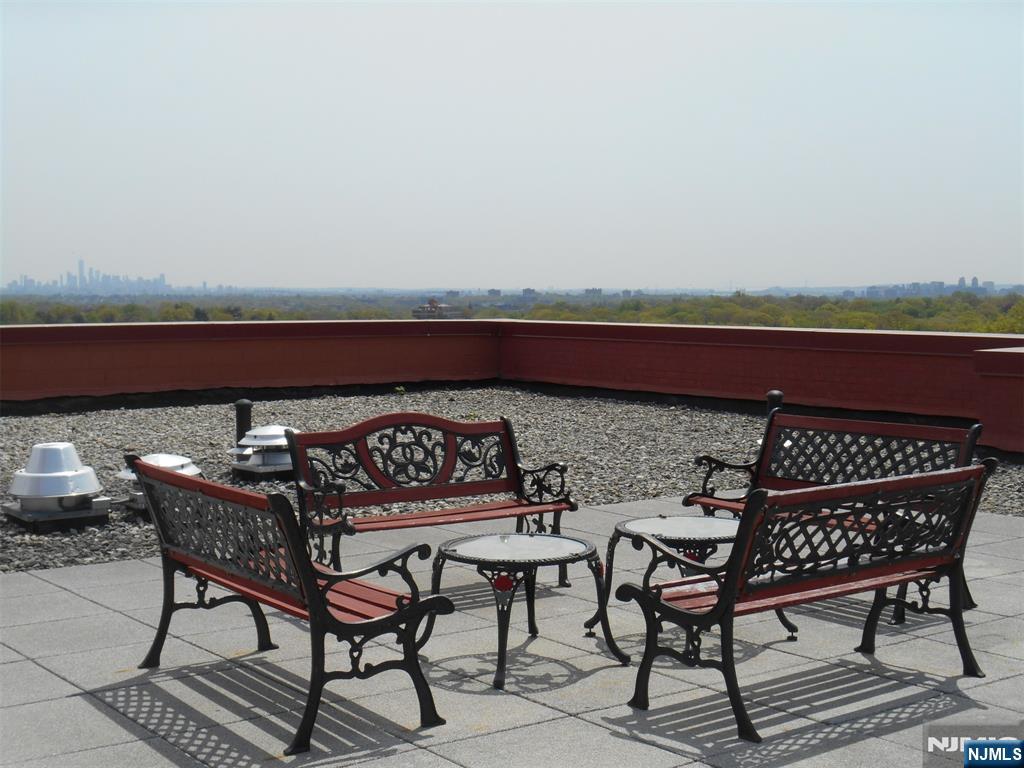 5 Roosevelt Place, Unit 2B Montclair, NJ 07042 - Photo 16 of 20 a terrace with outdoor seating and city view