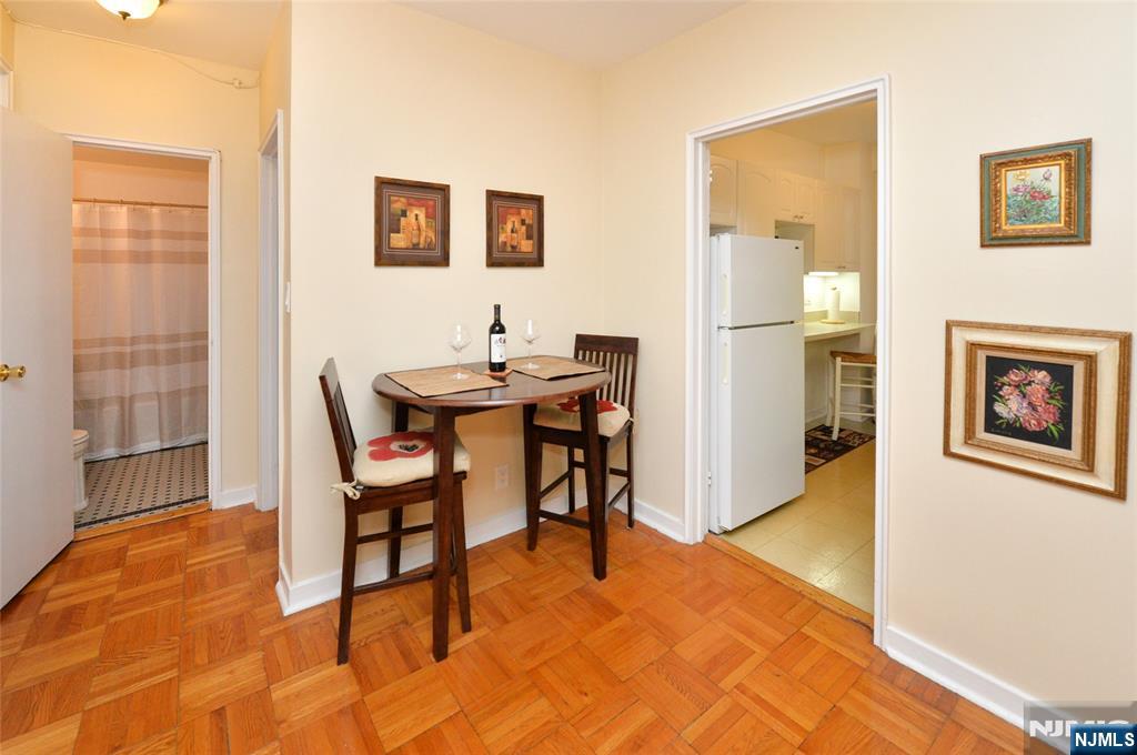 5 Roosevelt Place, Unit 2B Montclair, NJ 07042 - Photo 5 of 20 a view of a livingroom with furniture and a table in it