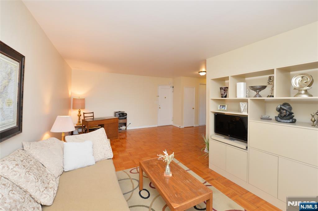 5 Roosevelt Place, Unit 2B Montclair, NJ 07042 - Photo 9 of 20 a living room with furniture and a flat screen tv
