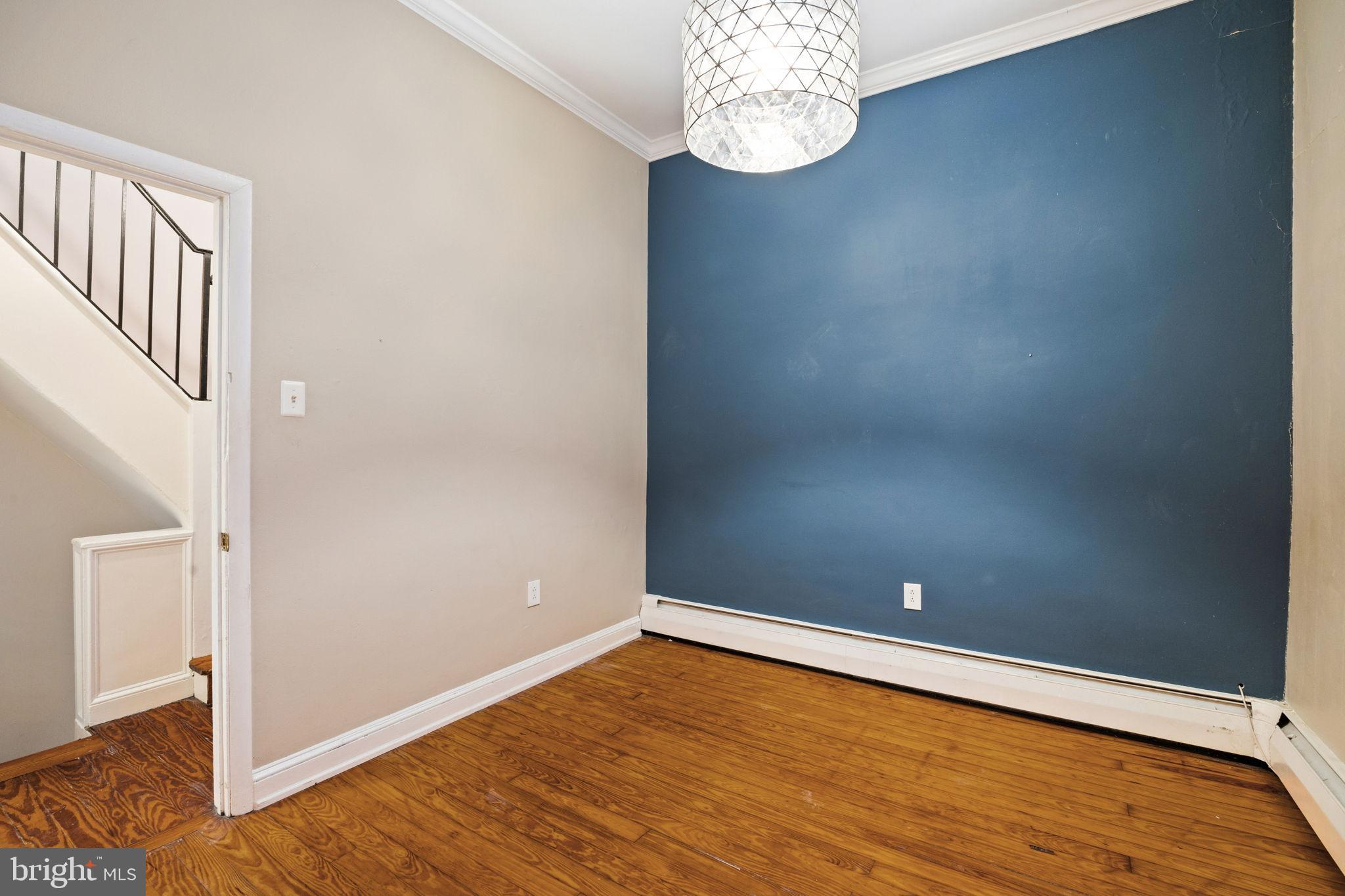 1238 Waverly Street Philadelphia, PA 19147 - Photo 11 of 24 an empty room with wooden floor and hallway