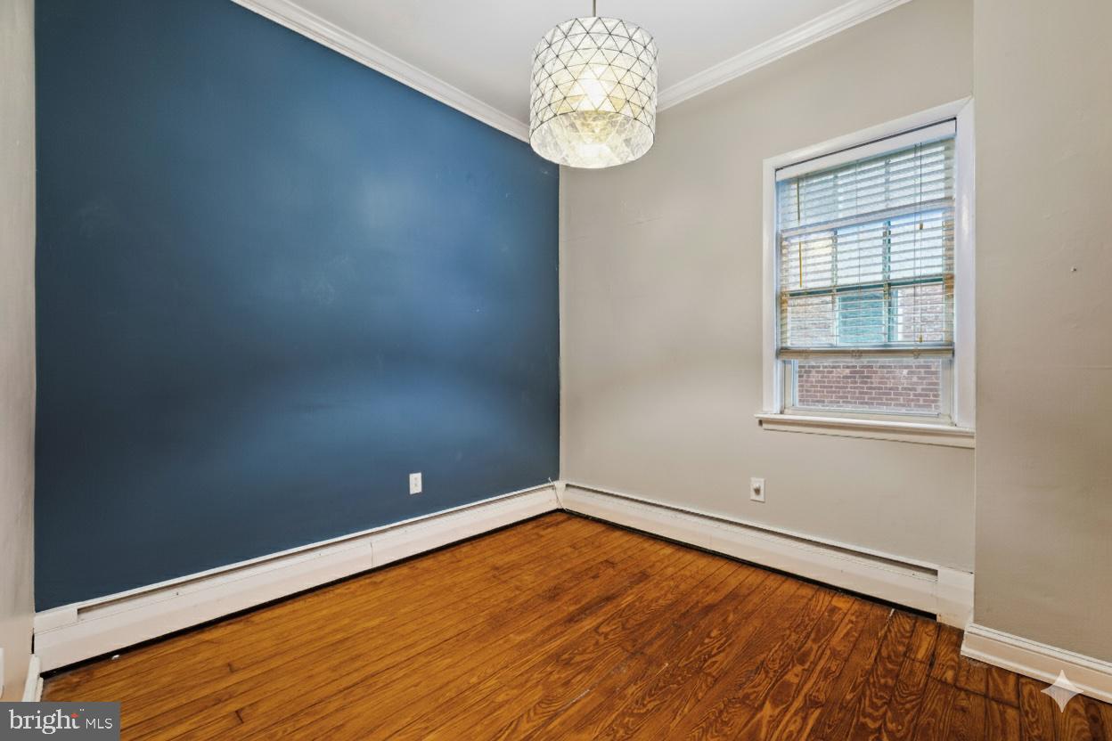 1238 Waverly Street Philadelphia, PA 19147 - Photo 12 of 24 an empty room with wooden floor and windows