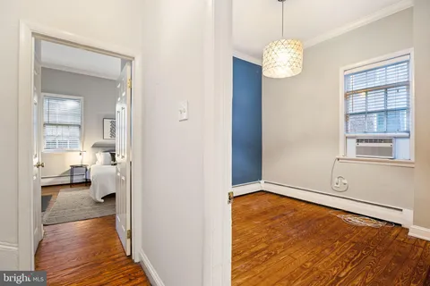 a view of a room window and wooden floor