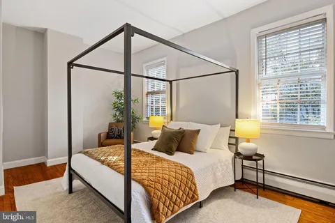 a bedroom with a bed and window