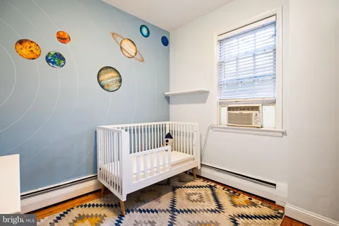 a view of an empty room and a window