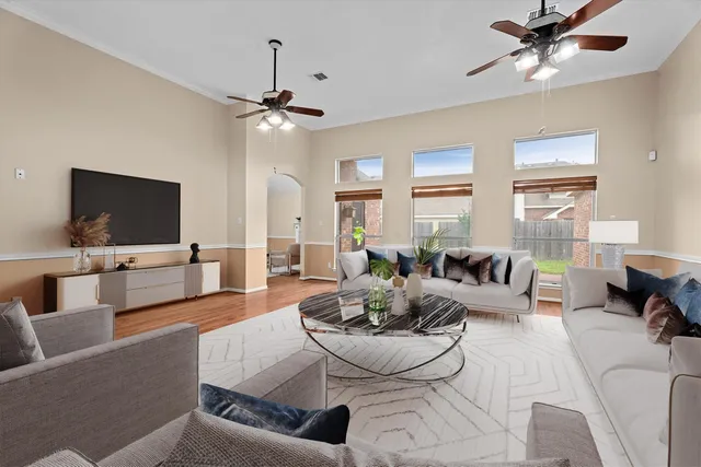 a living room with furniture and a flat screen tv