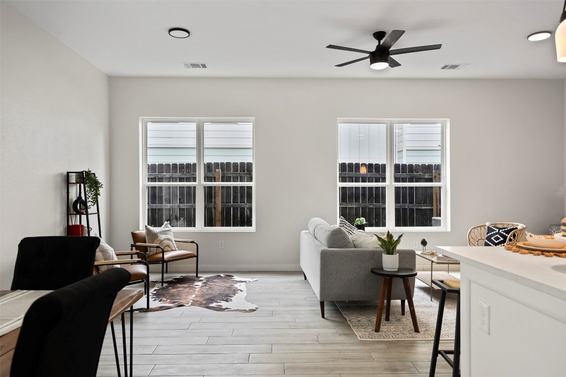 3611 Munson Street Austin, TX 78721 - Photo 18 of 40 a bedroom with furniture wooden floor and window