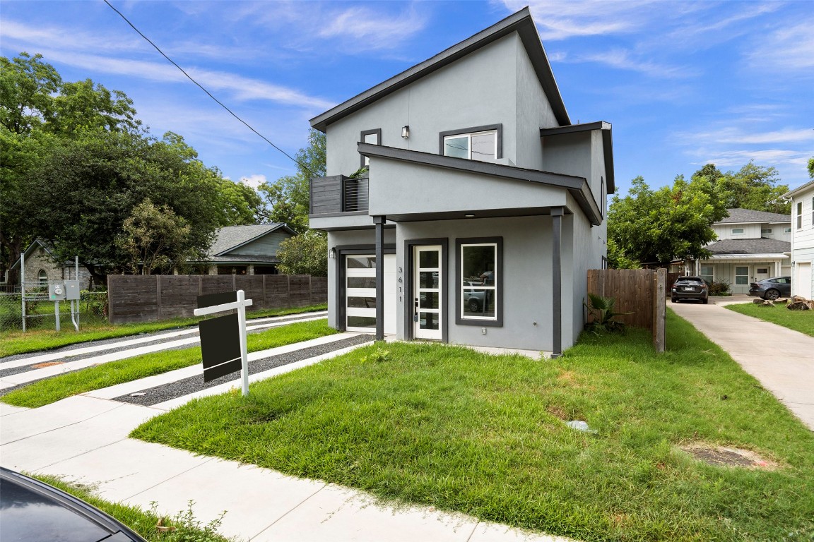 3611 Munson Street Austin, TX 78721 - Photo 2 of 40 a view of a house with a yard and a large tree