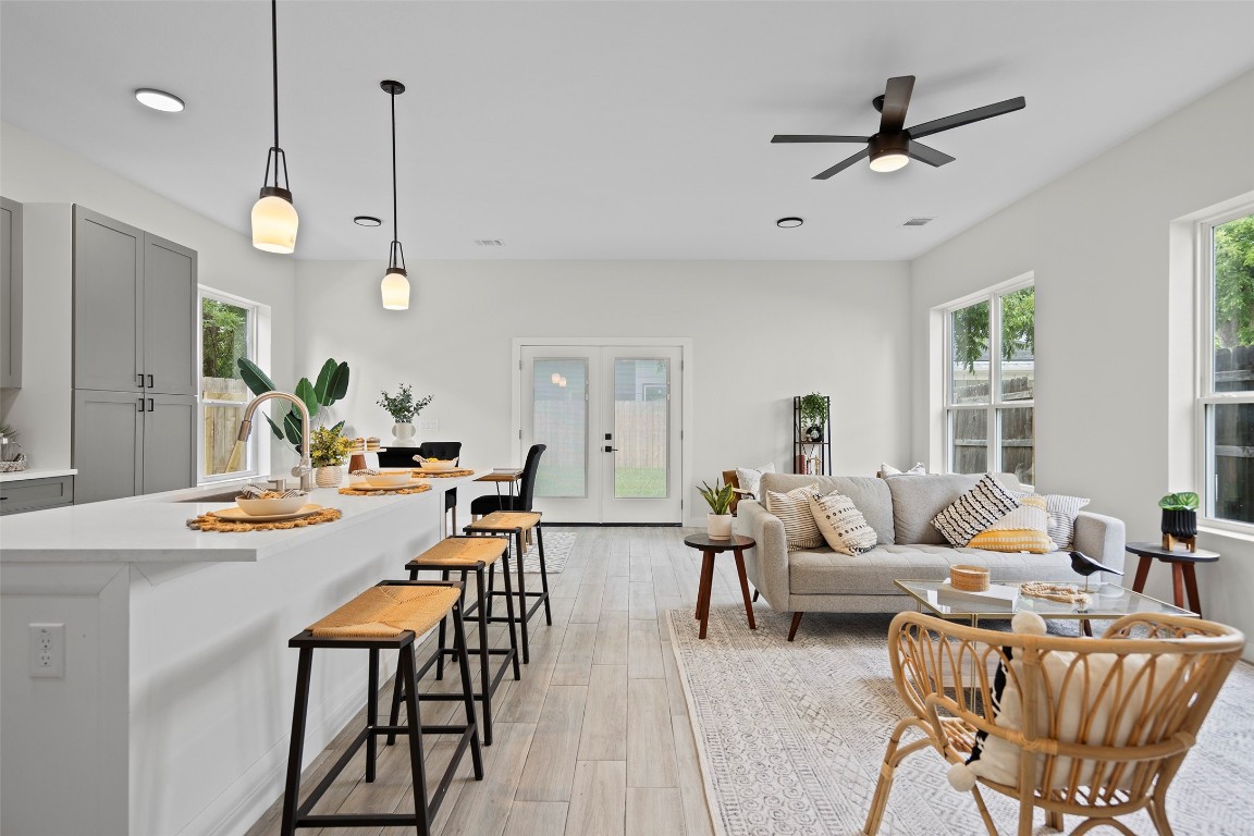 3611 Munson Street Austin, TX 78721 - Photo 22 of 40 a living room with furniture kitchen view and a large window