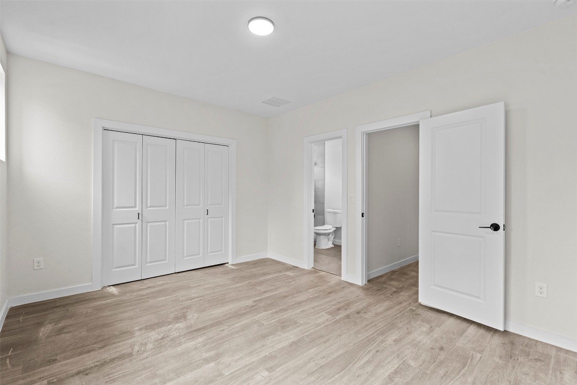 3611 Munson Street Austin, TX 78721 - Photo 27 of 40 a view of empty room with wooden floor