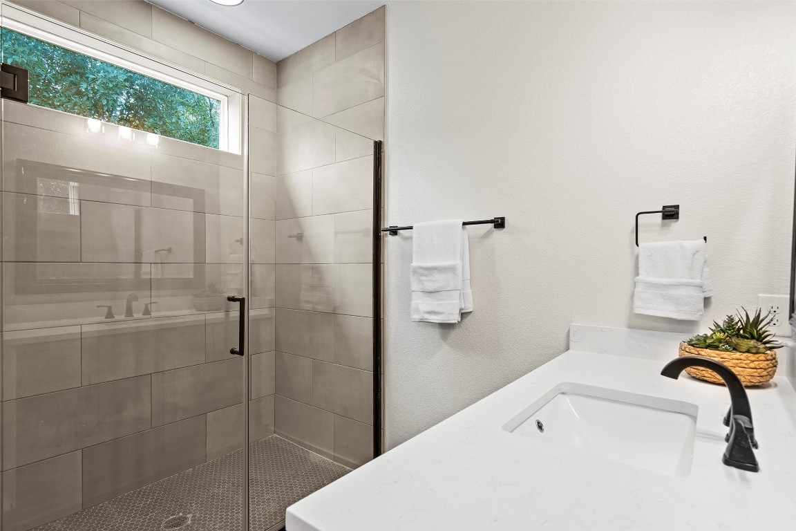 3611 Munson Street Austin, TX 78721 - Photo 34 of 40 a bathroom with a tub and a shower