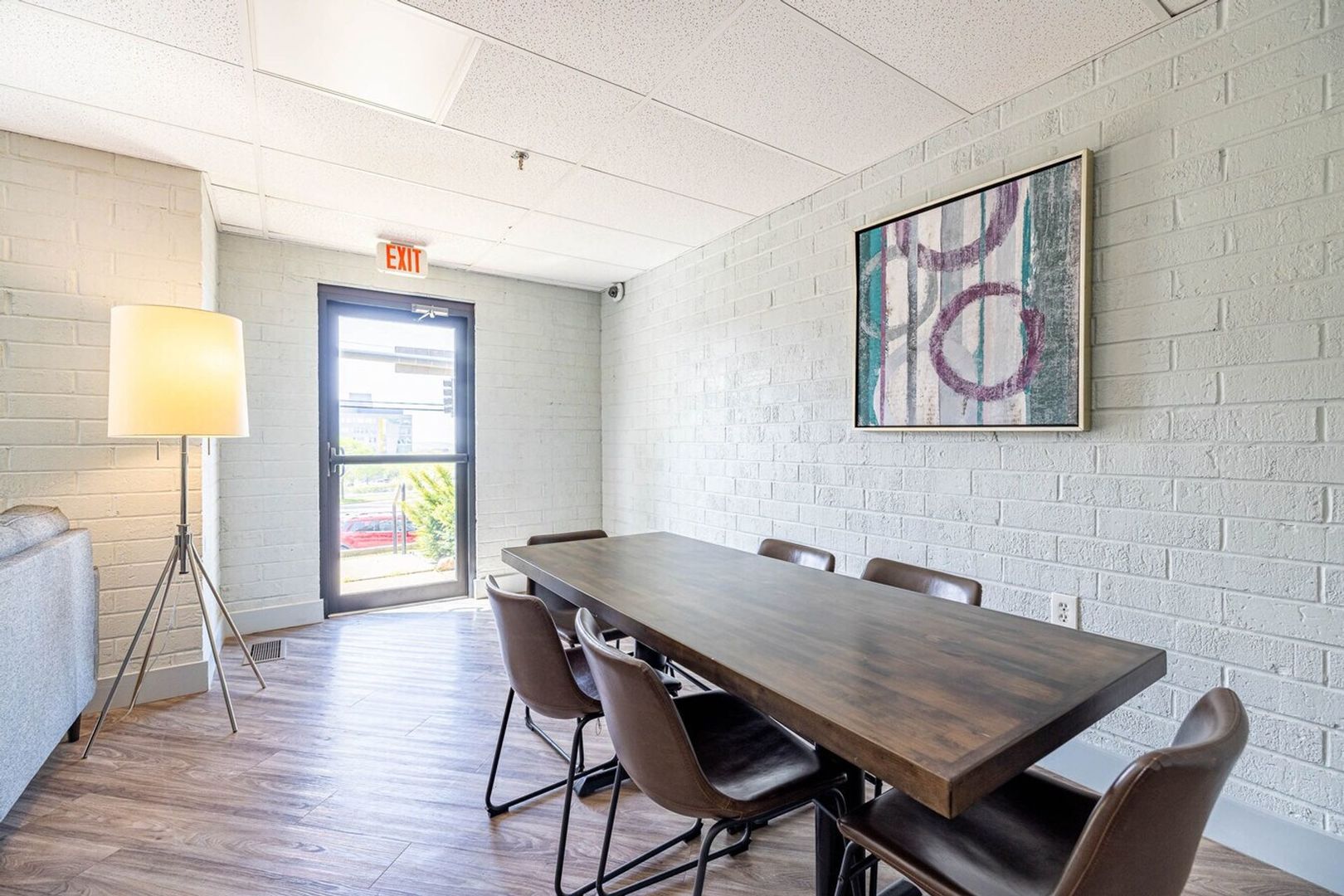1505 North Peoria Avenue, Unit 807 Peoria, IL 61603 - Photo 15 of 23 a view of a dining room with furniture window and wooden floor