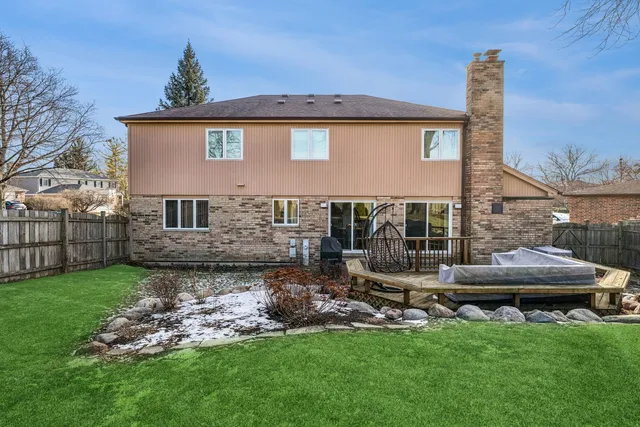 a front view of house with yard and outdoor seating
